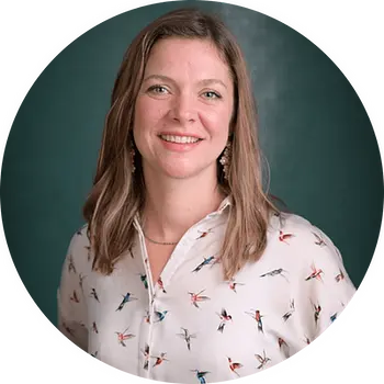 a professional headshot of Liza, CEO of Thresholds