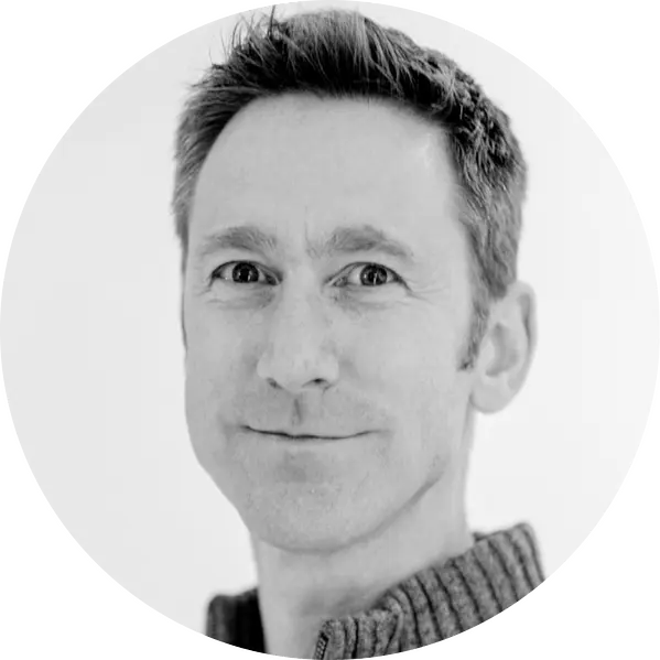 A professional headshot of Austin, Managing Director of AXM Studios